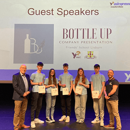 Students stood on a stage