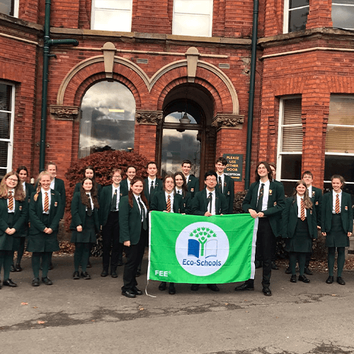 Students holding an Eco-School banner