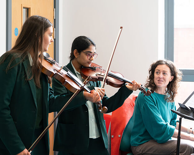 Students playing violins