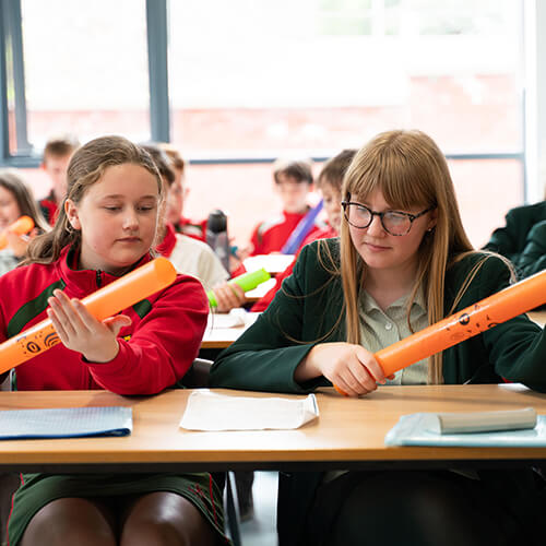 Students reading paper