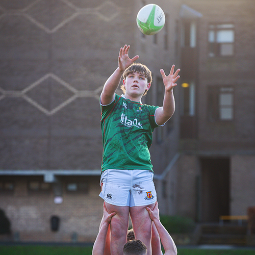 Student playing rugby